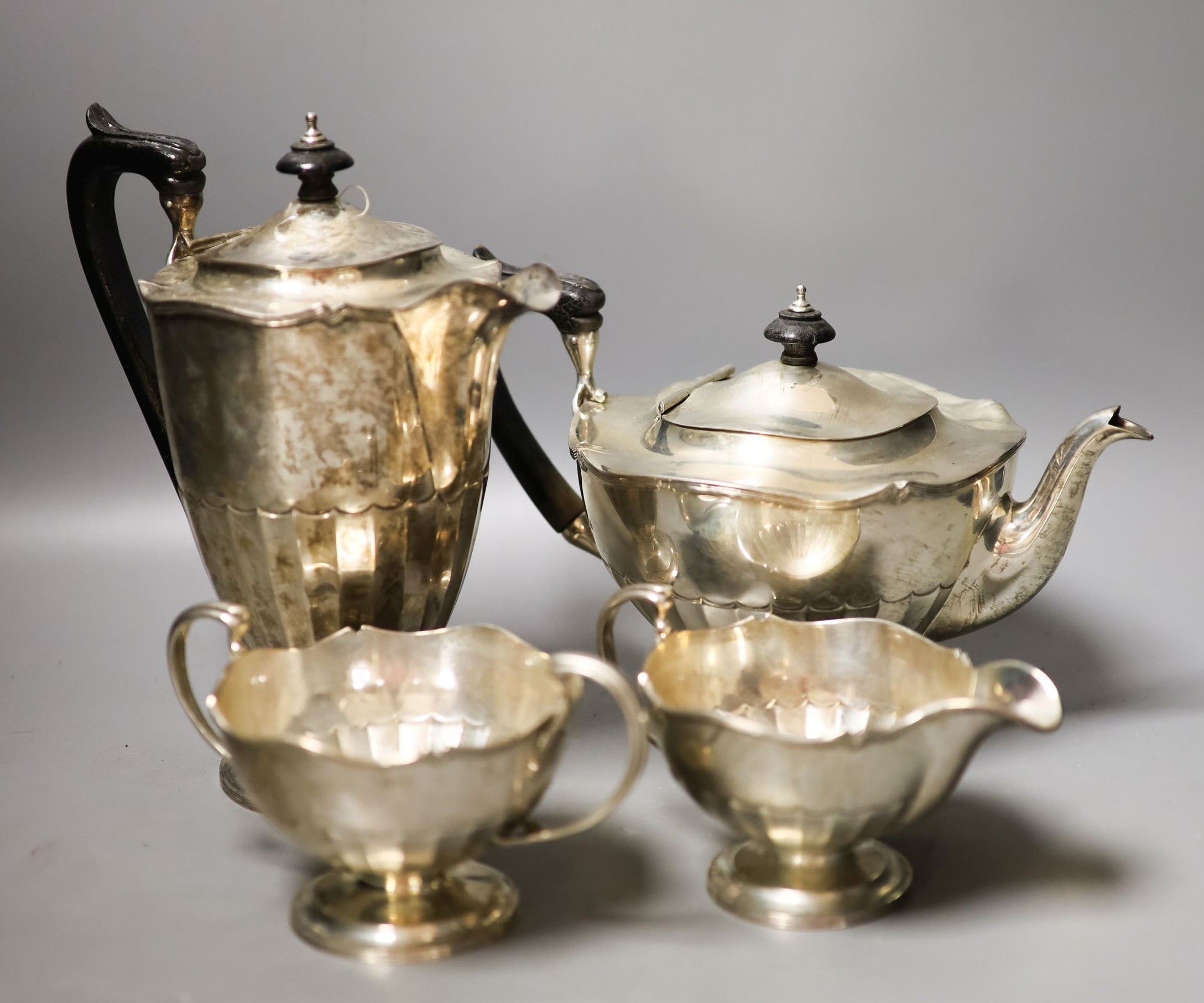 A George V four piece silver circular tea set, Fenton, Russel & Co Ltd, Birmingham, 1912